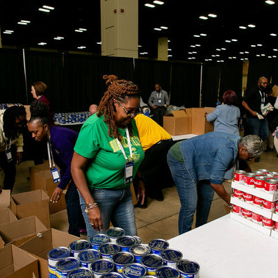 Volunteers assemble meal kits at Ellucian Live